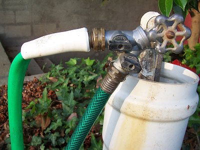 Near Kropf Road near Yoder, Oregon: Faucet and hoses catch the rising sun